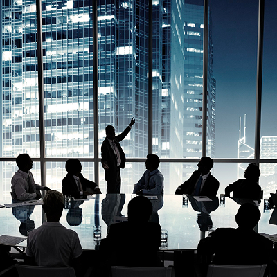 Business people in a board room meeting