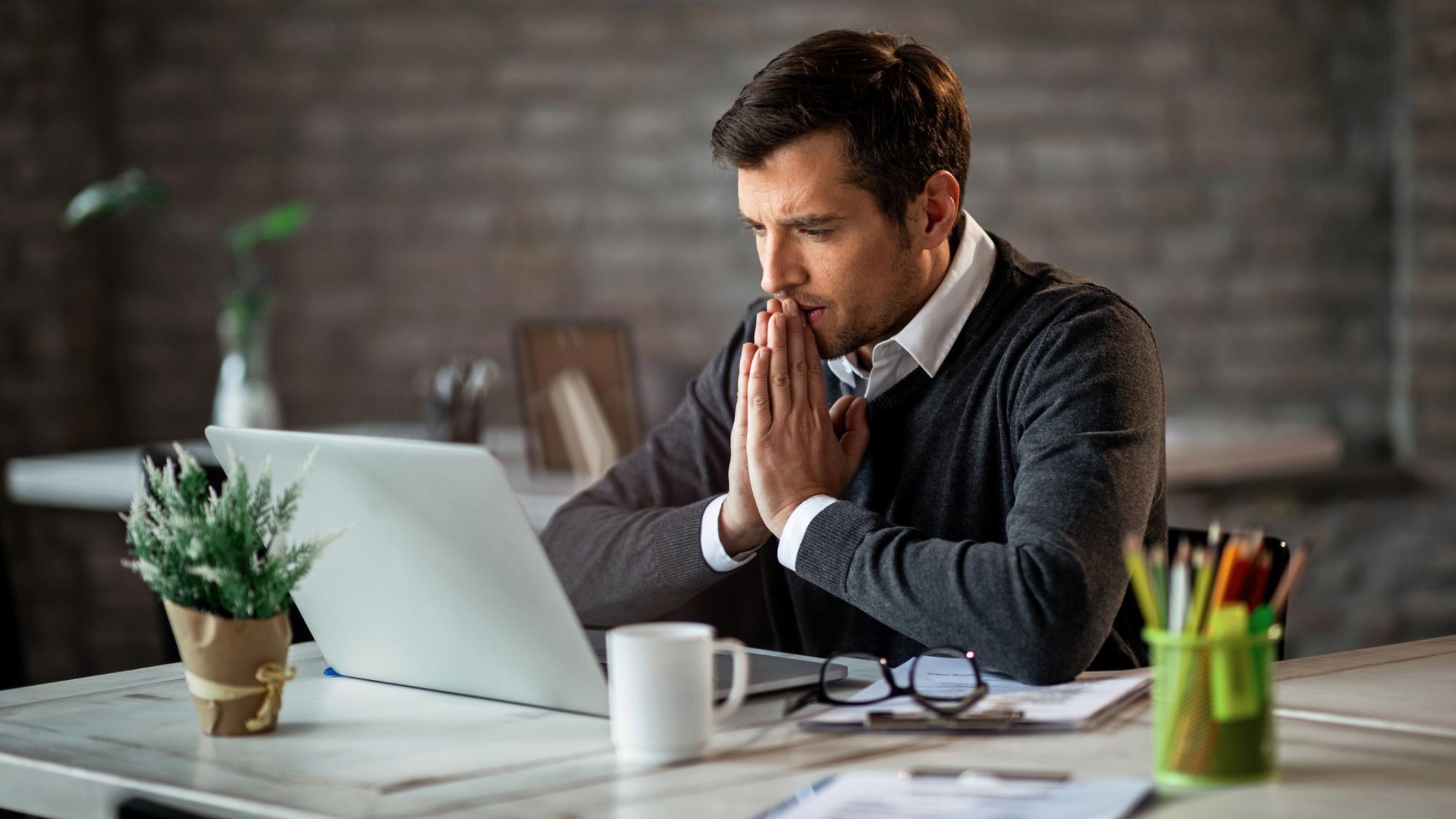 Pensive businessman working in the office